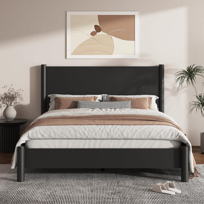 A modern black wooden bed frame with a tall upholstered headboard, styled with white and beige bedding, set in a minimalist bedroom with a gray rug, side table, and abstract wall art.