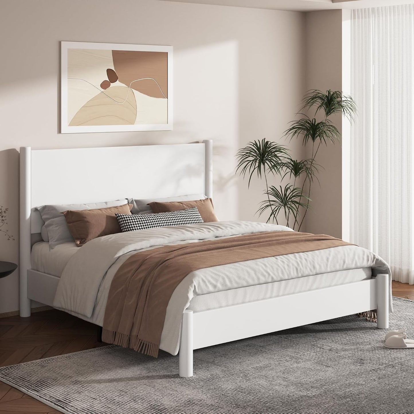 A modern white wooden bed frame with a tall headboard and matching footboard, styled in a minimalist bedroom with neutral beige and brown bedding, a gray rug, and a framed abstract print on the wall.