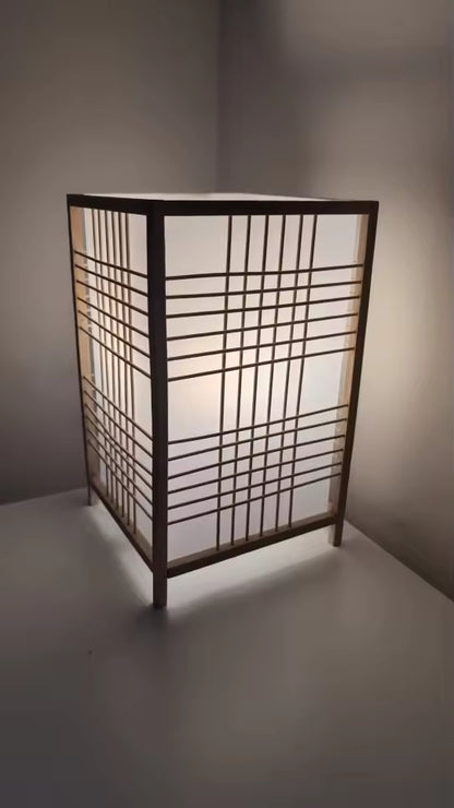 Decorative lamp with grid design on a plain background