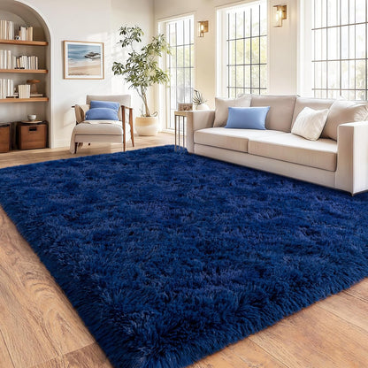 Blue shaggy rug in a living room with a beige sofa and wooden floor.
