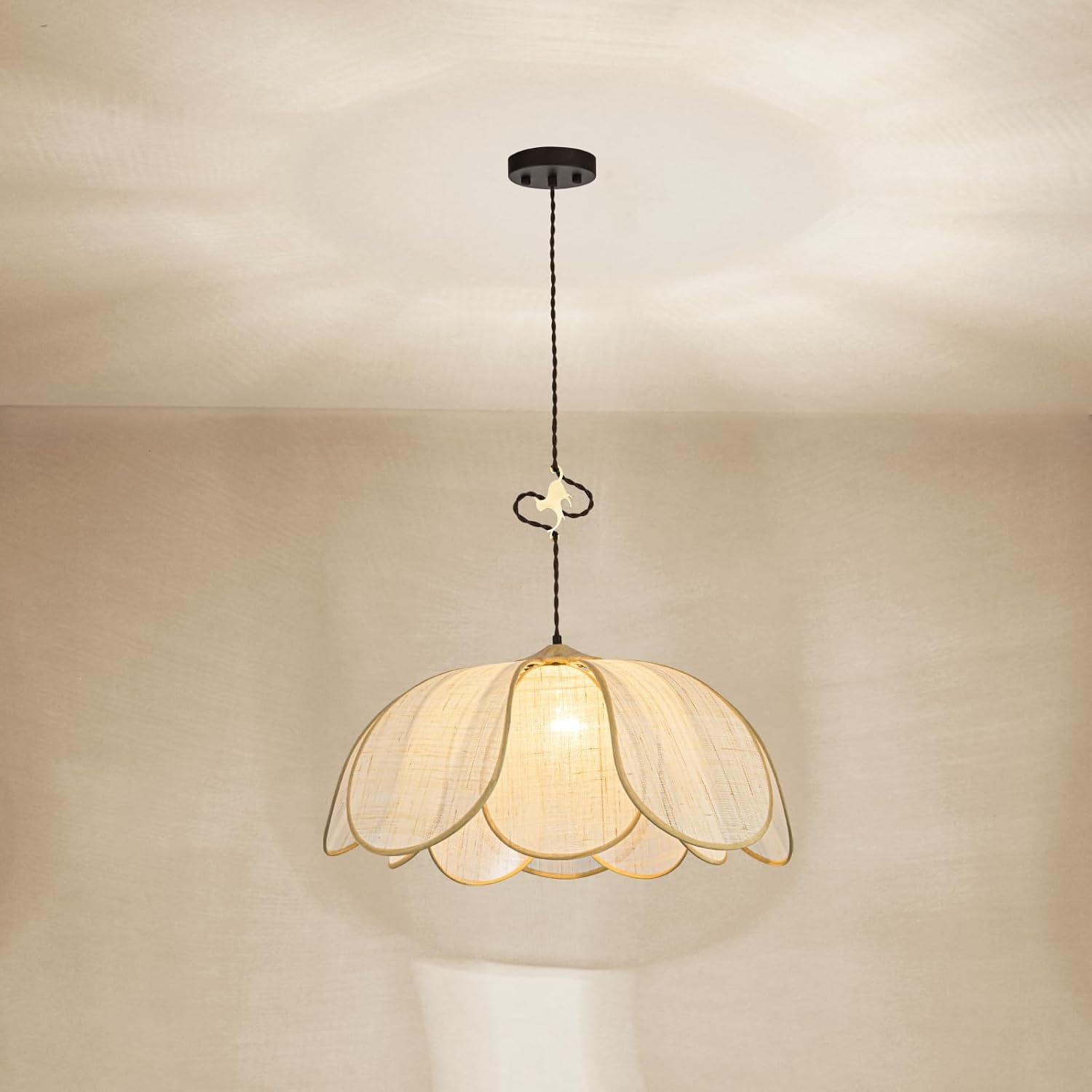 Decorative pendant light with floral design on a neutral background