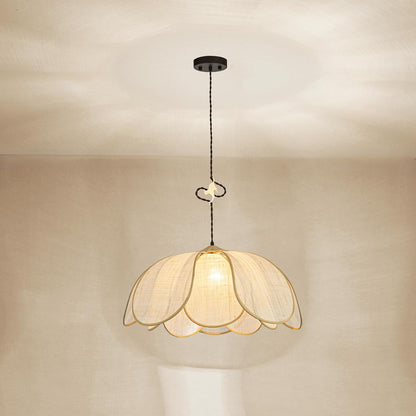 Decorative pendant light with floral design on a neutral background