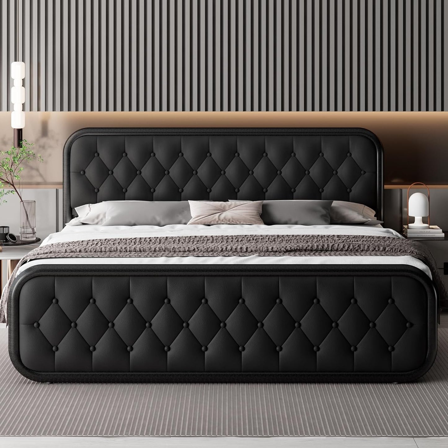 A modern black tufted upholstered bed with a tall matching headboard and footboard, styled in a contemporary bedroom with striped wall panels, neutral bedding, and bedside tables.
