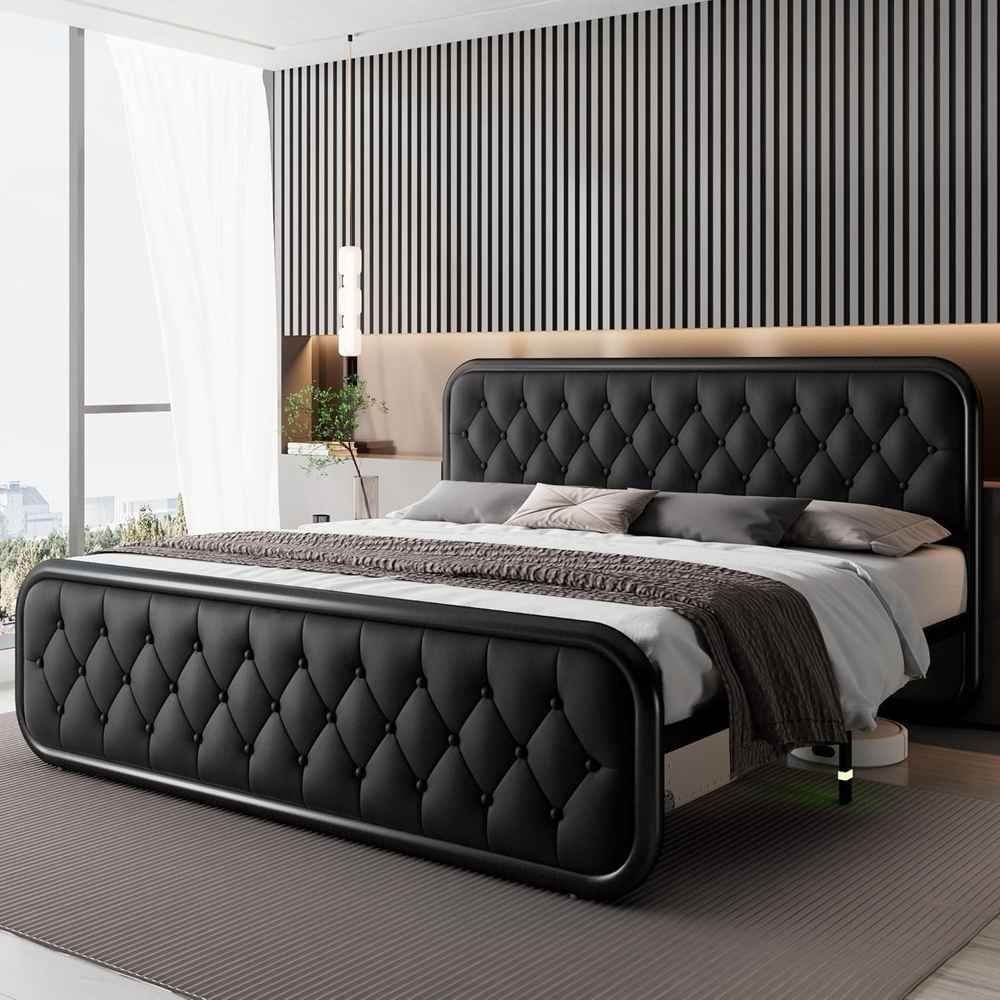 Modern bedroom with a black tufted bed and striped wall.