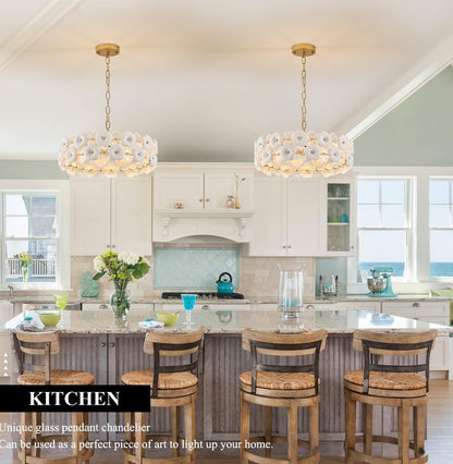 Modern kitchen with pendant lights and decorative elements.