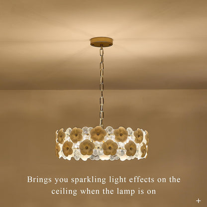 Decorative ceiling light fixture with floral design on a beige background
