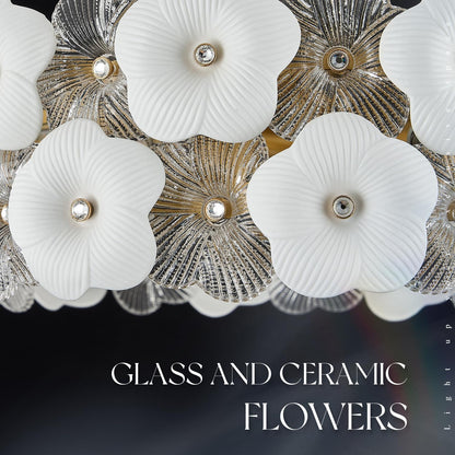 Decorative ceiling light fixture with glass and ceramic flowers on a dark background