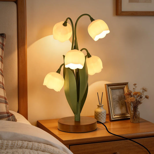 Decorative table lamp on a bedside table with warm lighting