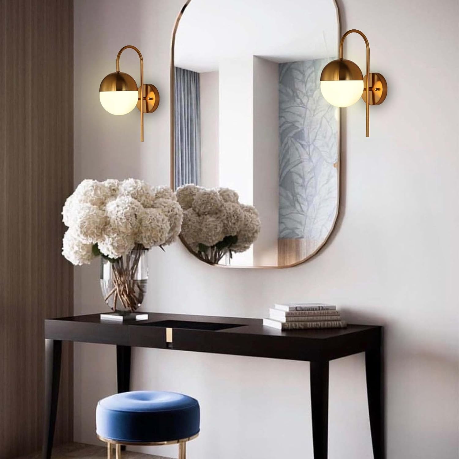 Modern interior with a console table, mirror, and decorative items.