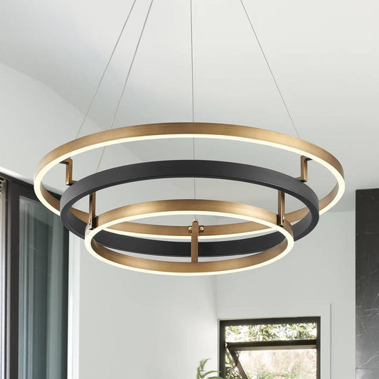 Modern pendant light with gold and black rings in a room setting
