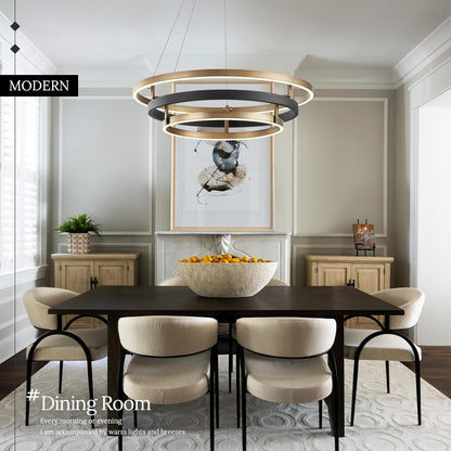 Modern dining room with a black table and white chairs, featuring a stylish chandelier.
