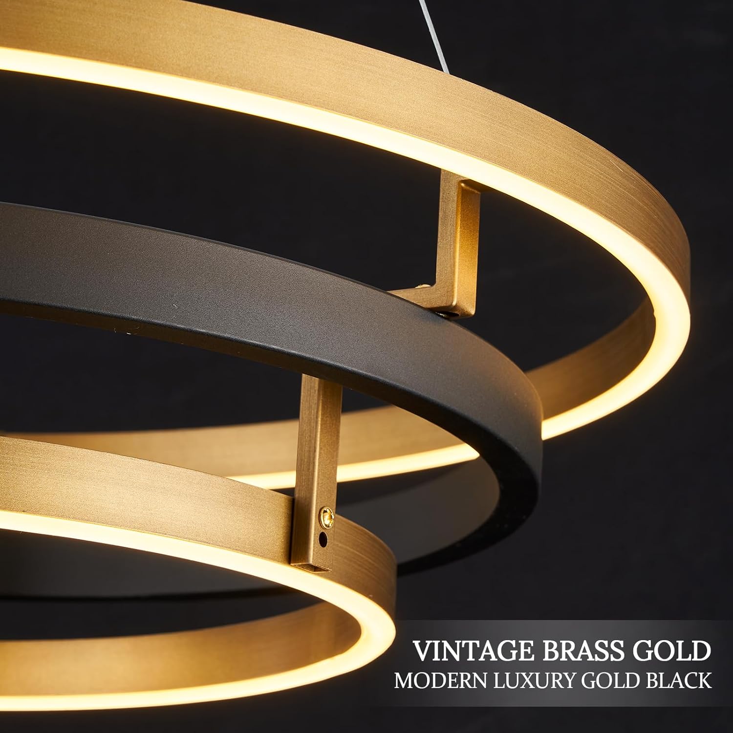 Modern chandelier with gold and black rings on a dark background