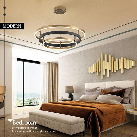 Modern bedroom with a chandelier, bed, and decorative wall art.