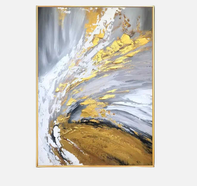 Abstract framed wall art featuring sweeping brushstrokes of white, gray, gold, and brown, presented in a thin gold frame against a light gray background.