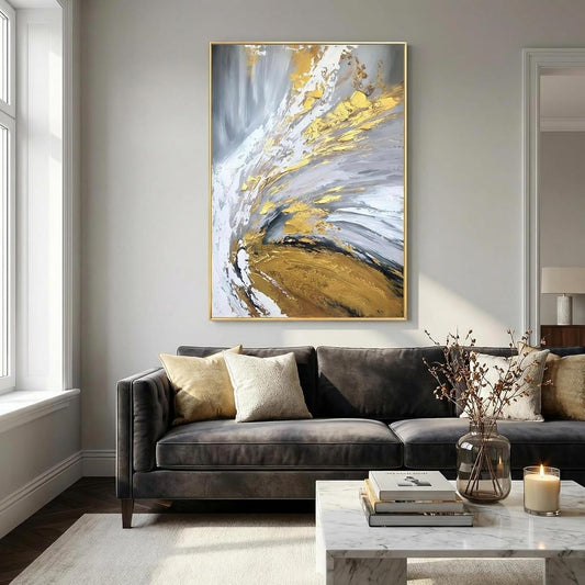 Modern living room with a gray sofa, abstract painting, and decorative items.