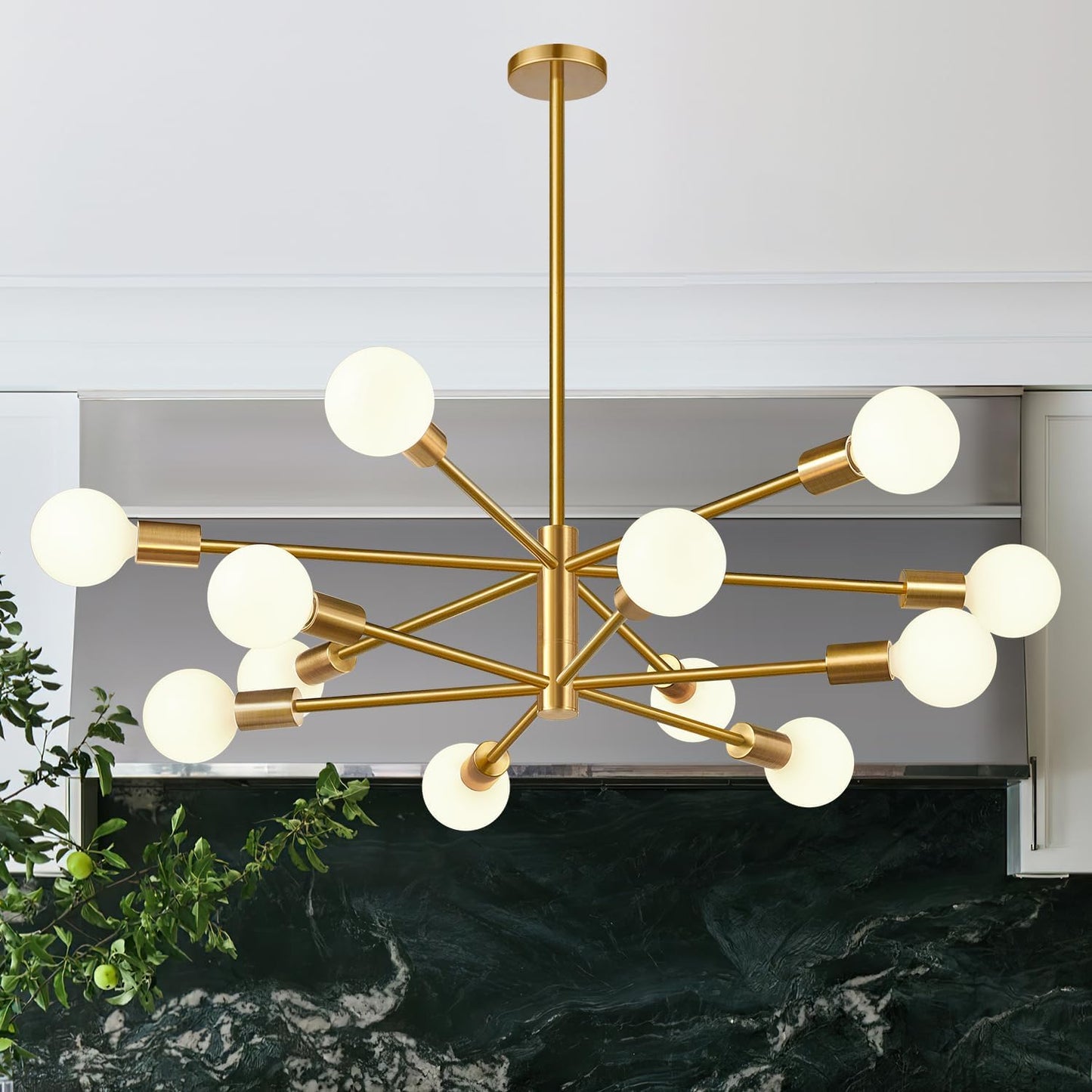 Gold chandelier with white bulbs hanging above a dark surface.