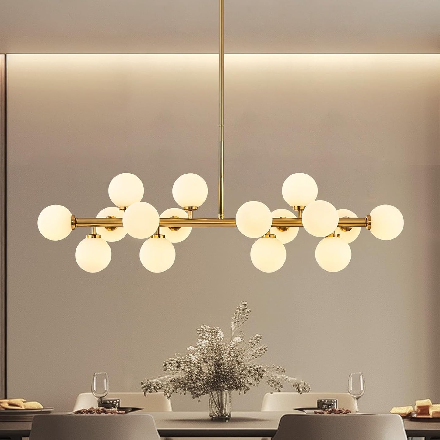 Modern chandelier with gold frame and white glass bulbs in a dining room setting.