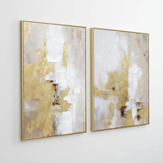 Two abstract art pieces with gold and white tones in gold frames on a white background.