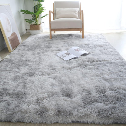 Gray shaggy rug in a living room with a chair and plant