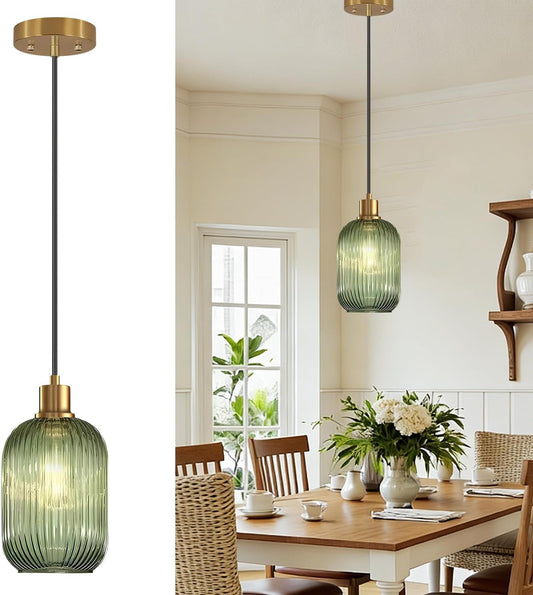 Dining room with green pendant lights and a table set for a meal.