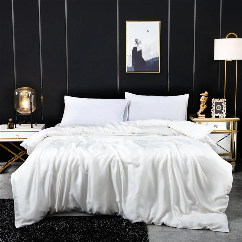 Bedroom with white comforter and black walls, featuring Midnight Serenity Silk Duvet Cover.