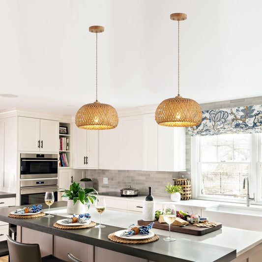 Modern kitchen with wicker pendant lights, white cabinets, and a dining table set.