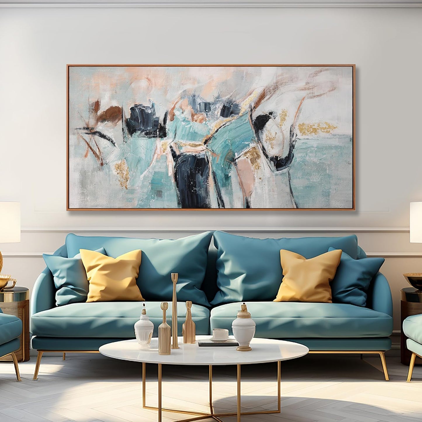A large framed abstract canvas print with teal, cream, black, and gold brushstrokes hangs on a light gray wall above a teal sofa with yellow accent pillows in a modern living room setting.