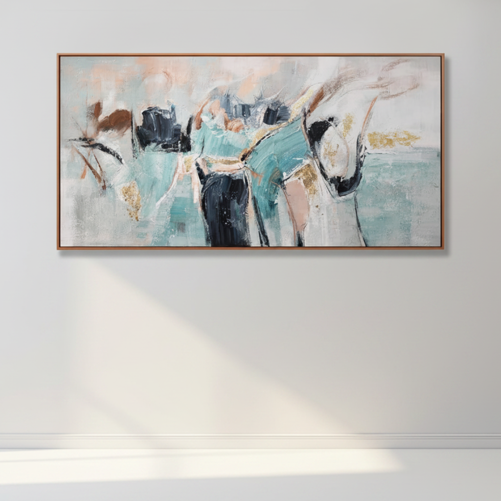 A framed abstract canvas painting featuring figures in teal, black, white, and beige tones, hung on a light gray wall with soft sunlight casting a shadow below.
