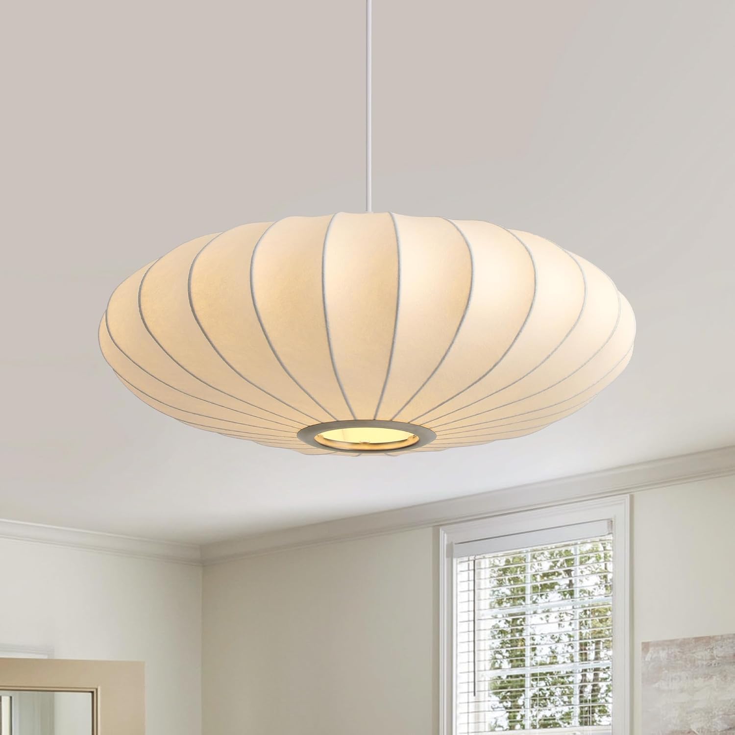 Ceiling light fixture in a room with a window