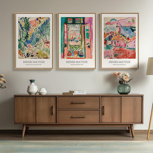 Wooden sideboard with Henri Matisse art prints on a wall