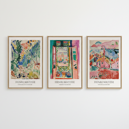 Three framed Henri Matisse art prints hanging side-by-side on a white wall. Each print features a colorful, textured painting of a different scene (garden, doorway, and houses) with 'HENRI MATISSE' printed in black at the bottom.