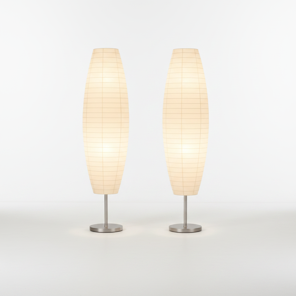 Two beige table lamps with metallic bases on a white background