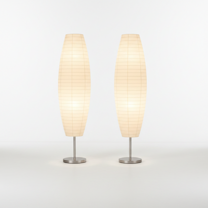Two beige table lamps with metallic bases on a white background