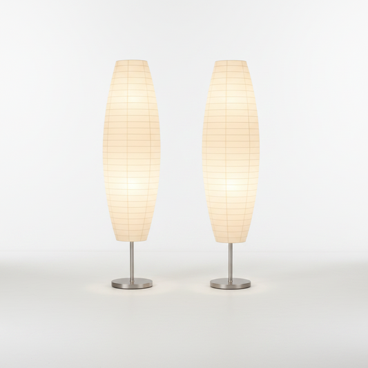 Two beige table lamps with metallic bases on a white background