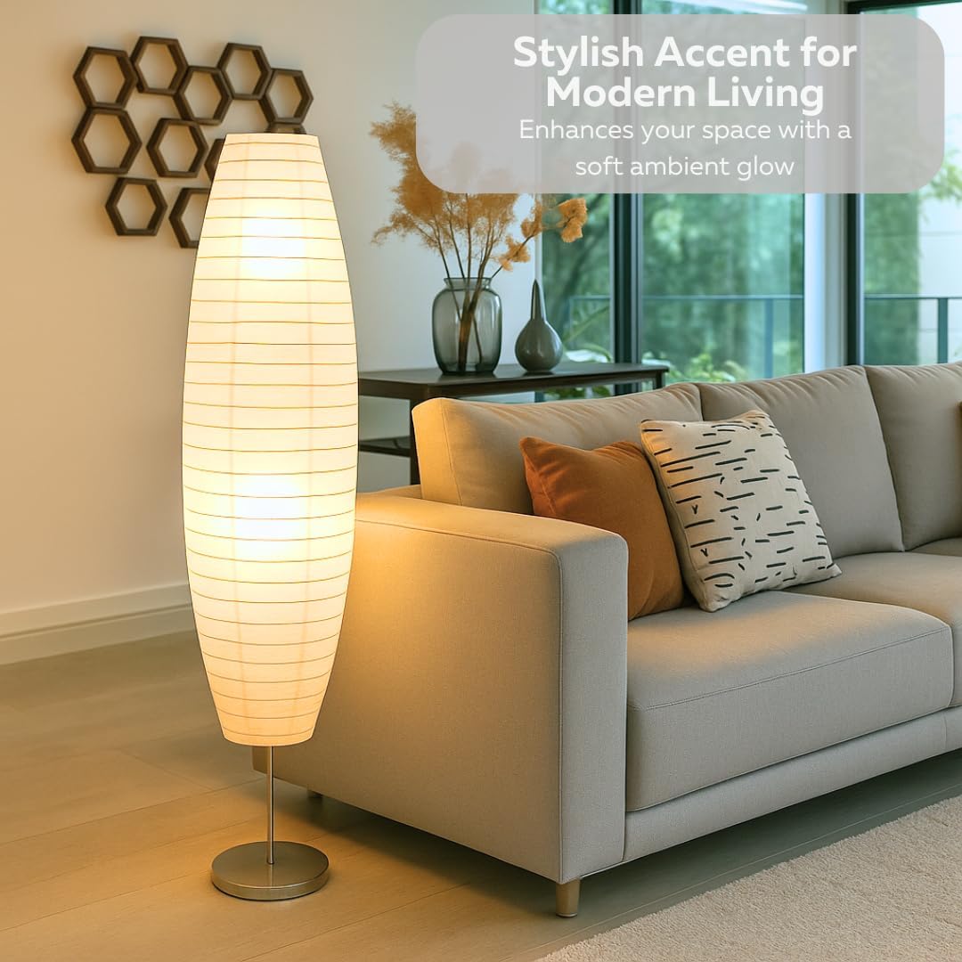 Floor lamp in a living room setting with a couch and decorative elements.
