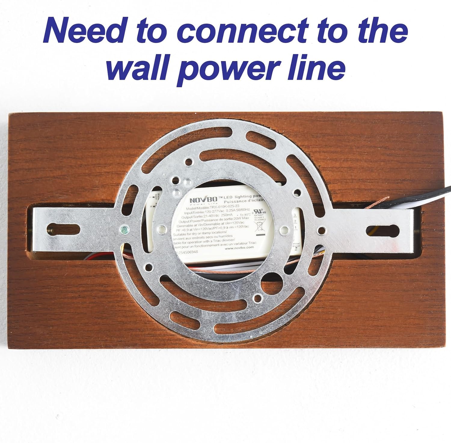 Metallic disc with wooden frame and text 'Need to connect to the wall power line' on a white background