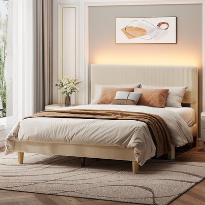 Neatly made bed with beige bedding and pillows in a bedroom setting.