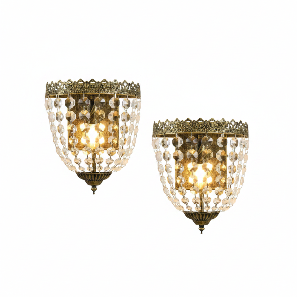 Two ornate wall sconces with crystal beads on a white background