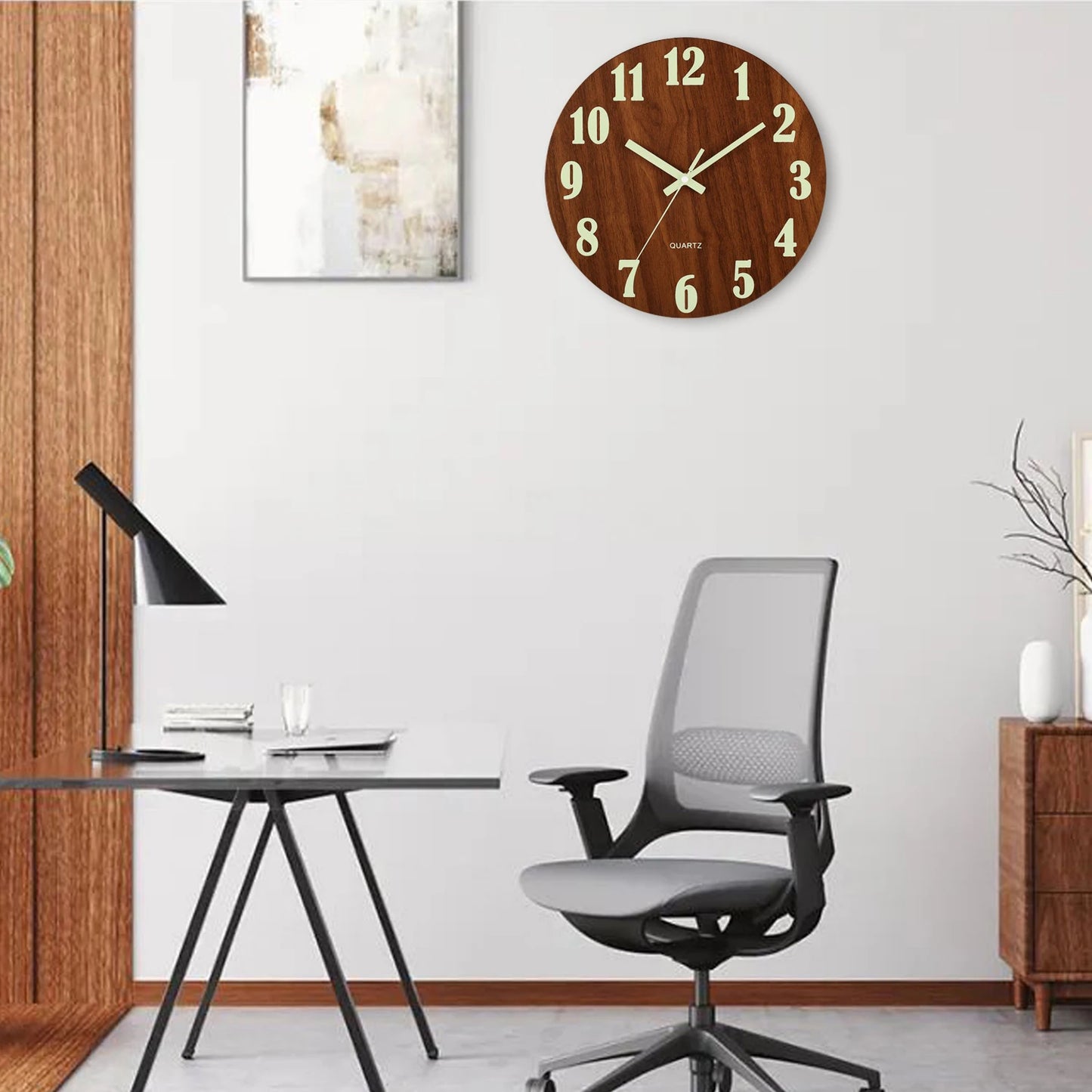 Modern office setup with a desk, chair, and wall clock.