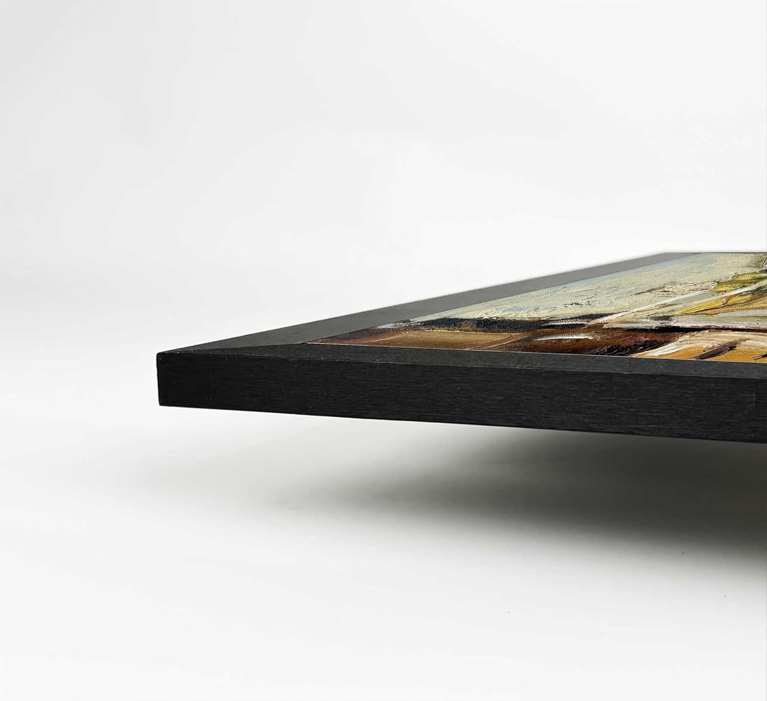 Close-up of a black framed picture on a white background