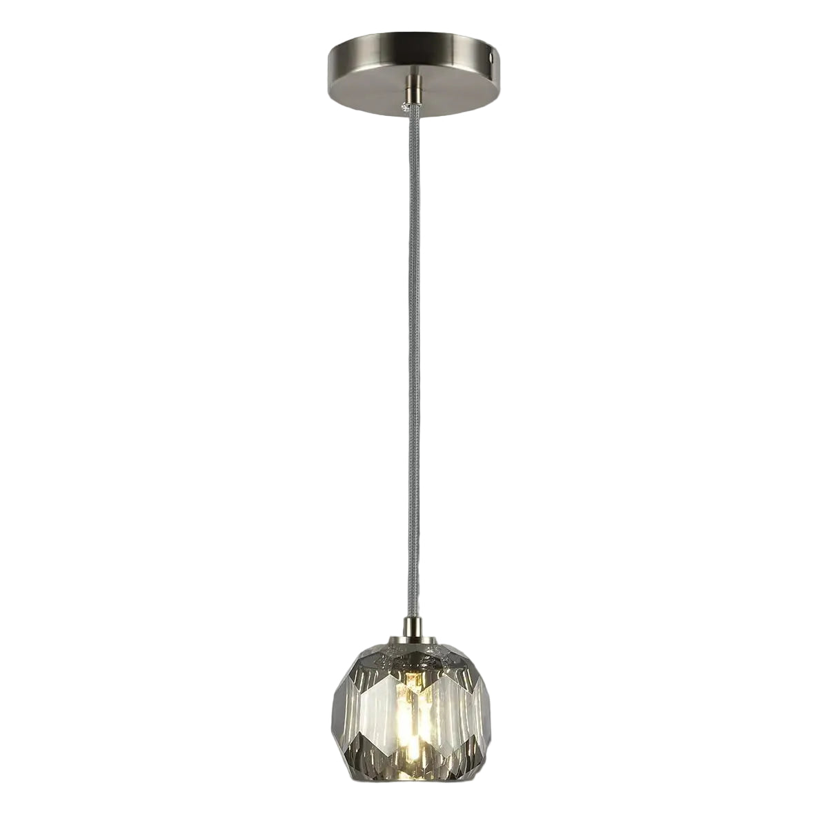 Pendant light with glass shade and metallic fixture on a gray background