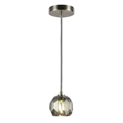 Pendant light with glass shade and metallic fixture on a gray background