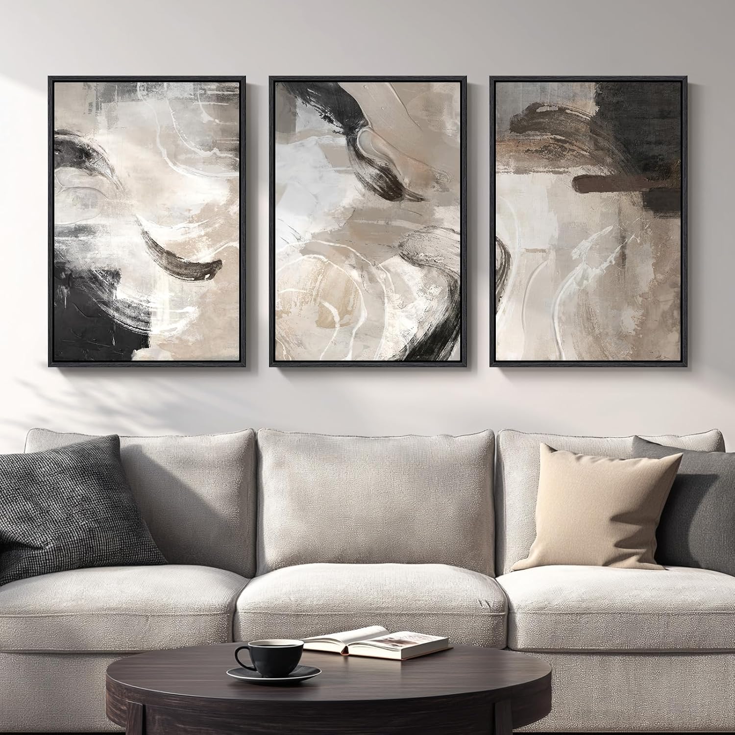 Three abstract art pieces above a sofa in a living room setting.
