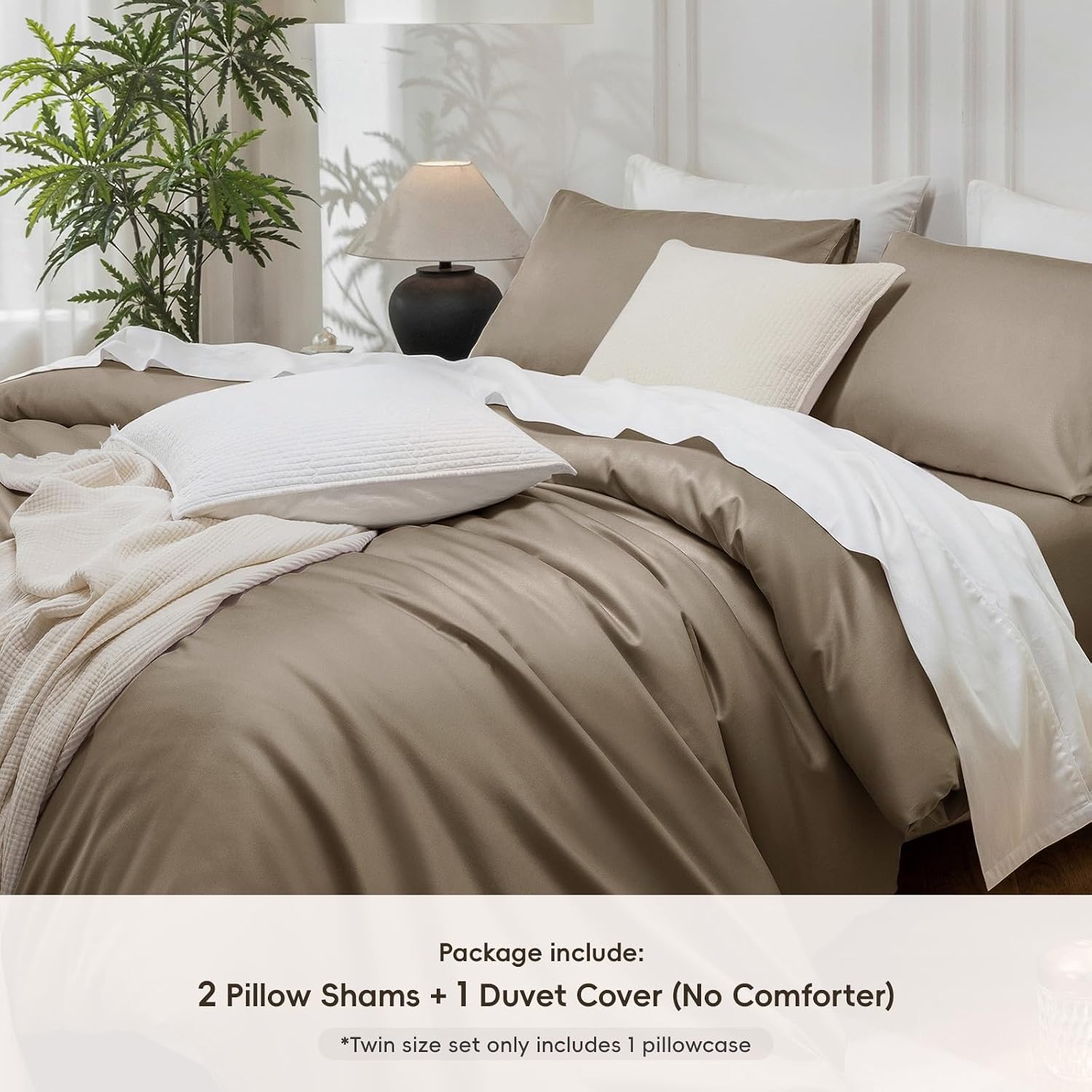 Bedding set with brown duvet cover and pillow shams in a bedroom setting.