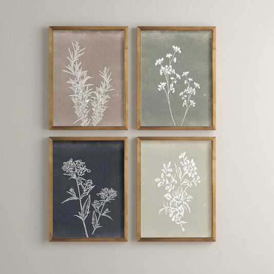Four framed botanical prints with white flowers on a neutral background