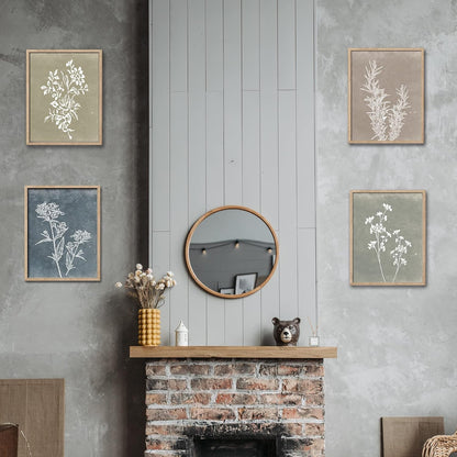 Decorative wall art above a fireplace with a round mirror and small items.