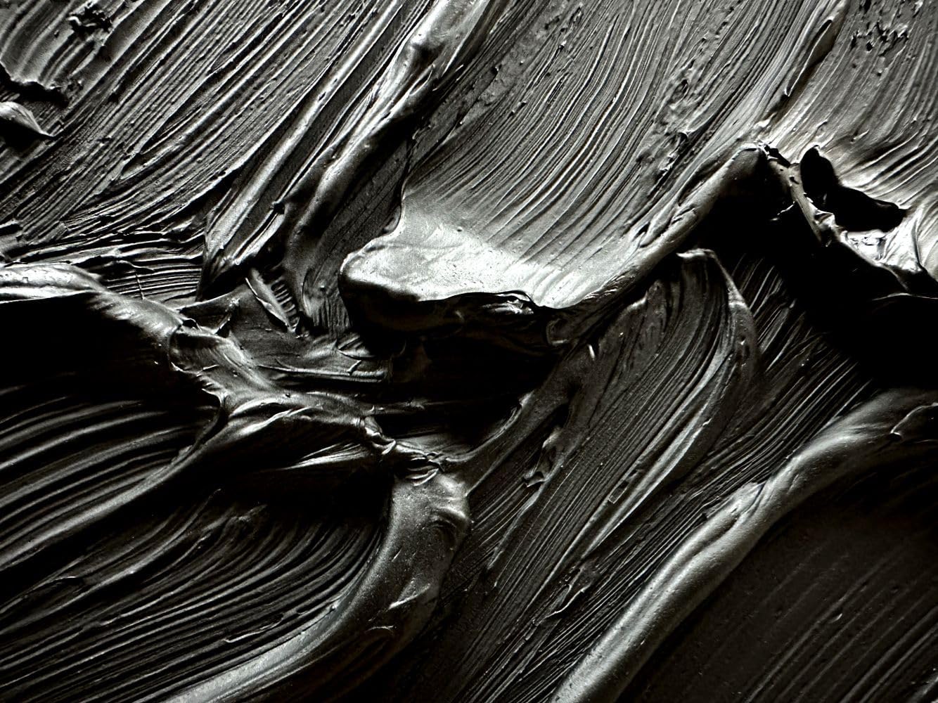 Close-up of black and white textured paint strokes