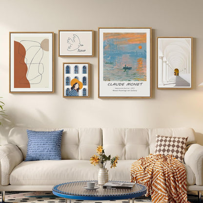 Living room with a beige sofa, decorative pillows, and framed art on the wall.