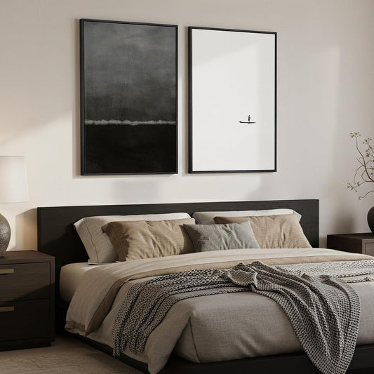 Modern bedroom with a bed, nightstands, and framed artwork on the wall.
