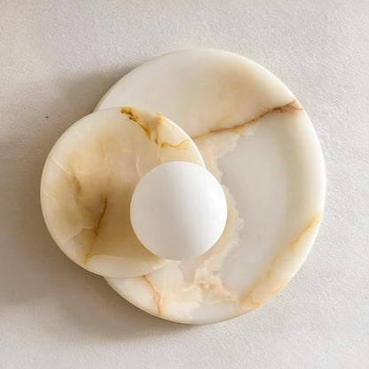 Marble-patterned ring holder on a light gray background